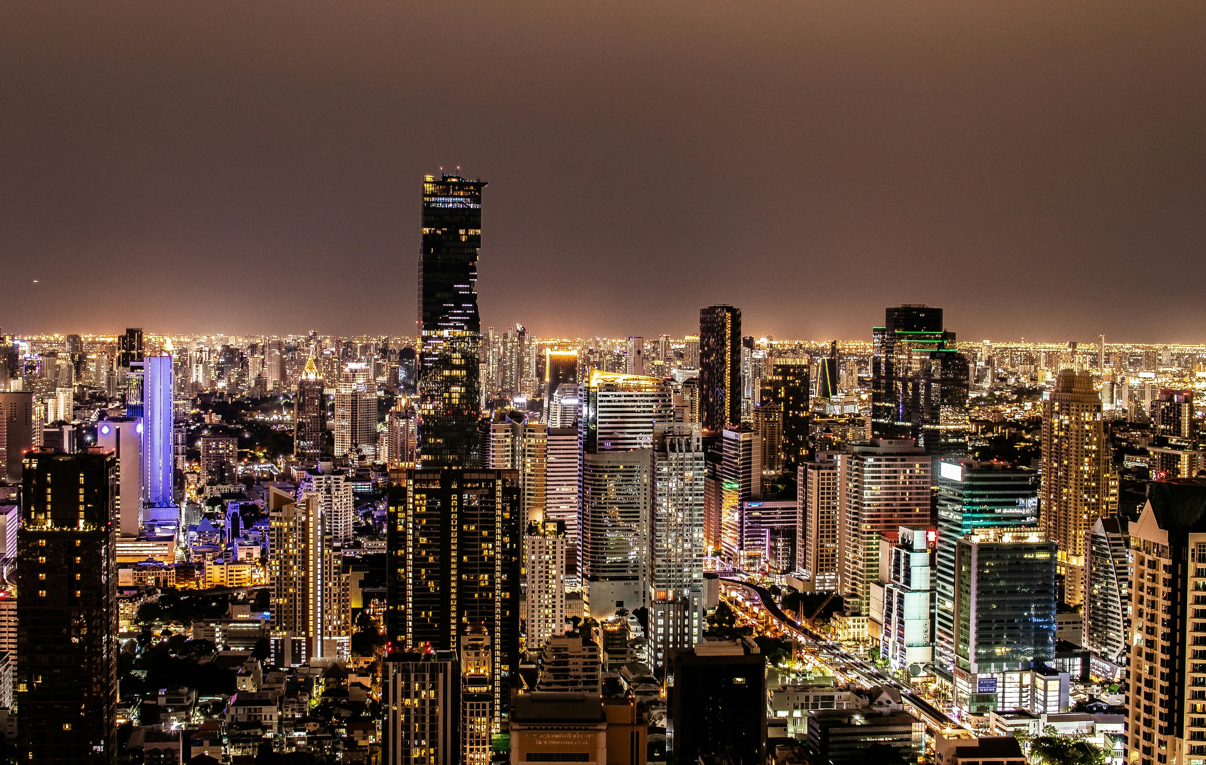 Bangkok skyline at night with rooftop bars and tropical urban energy Thailand