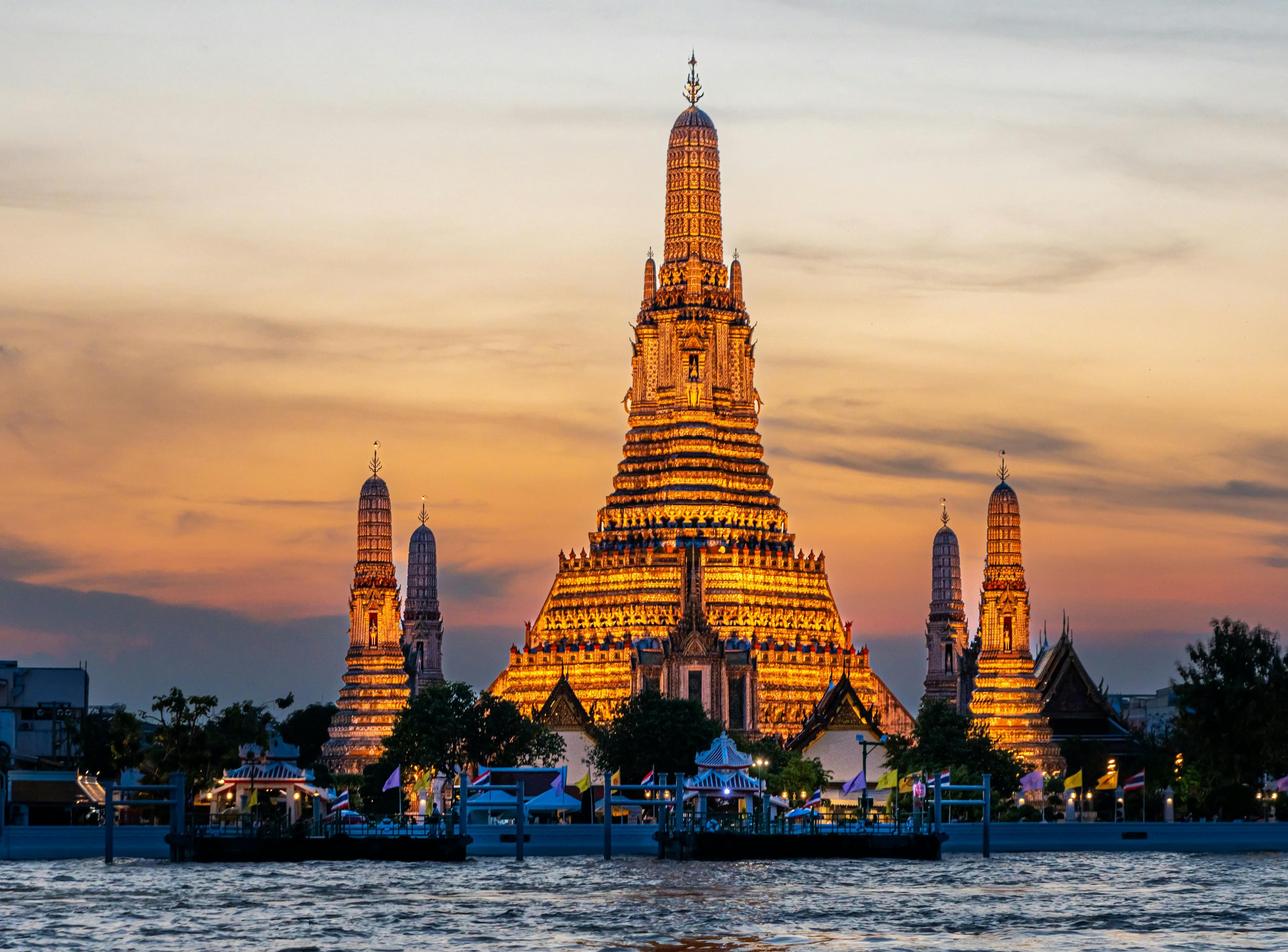 Wat Arun Temple of Dawn at sunset Chao Phraya river Bangkok Thailand