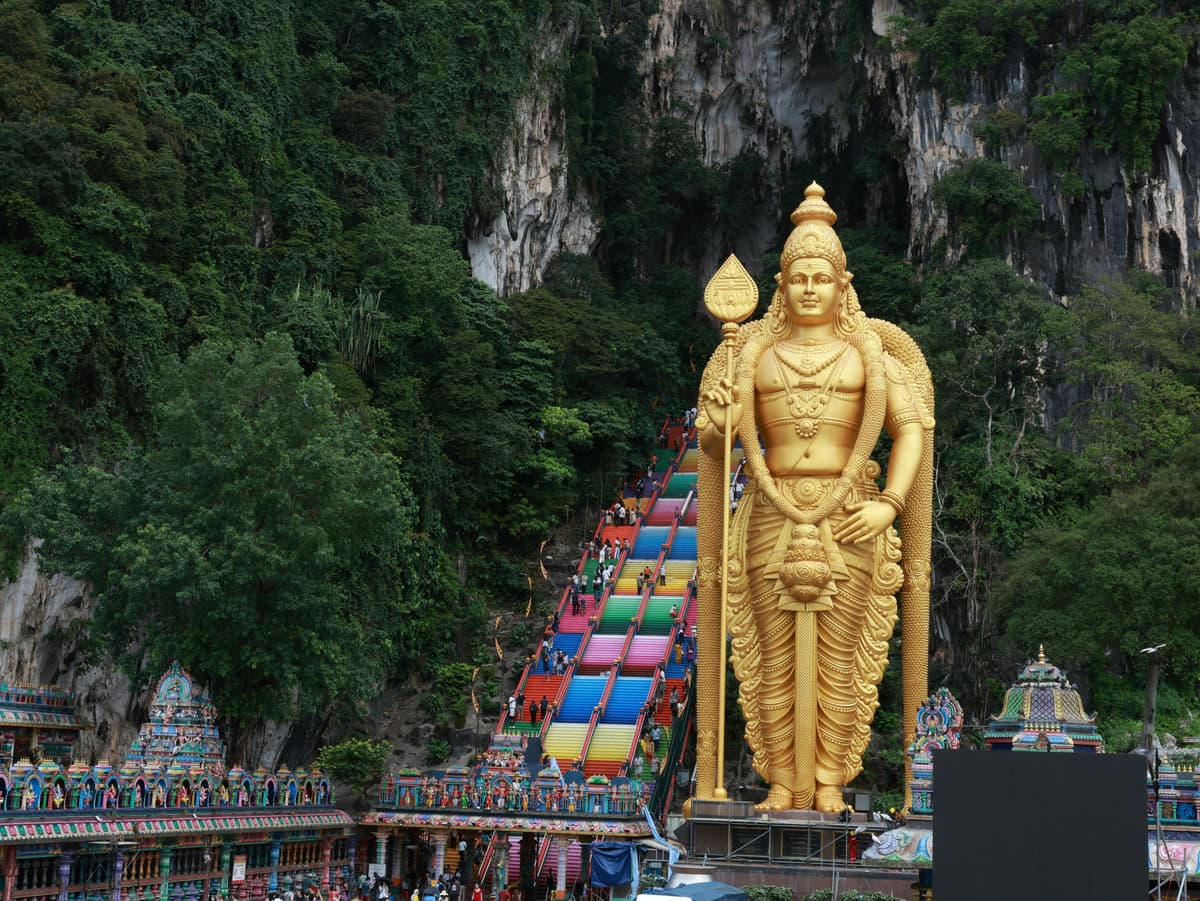 Batu Caves golden statue and rainbow stairs Kuala Lumpur
