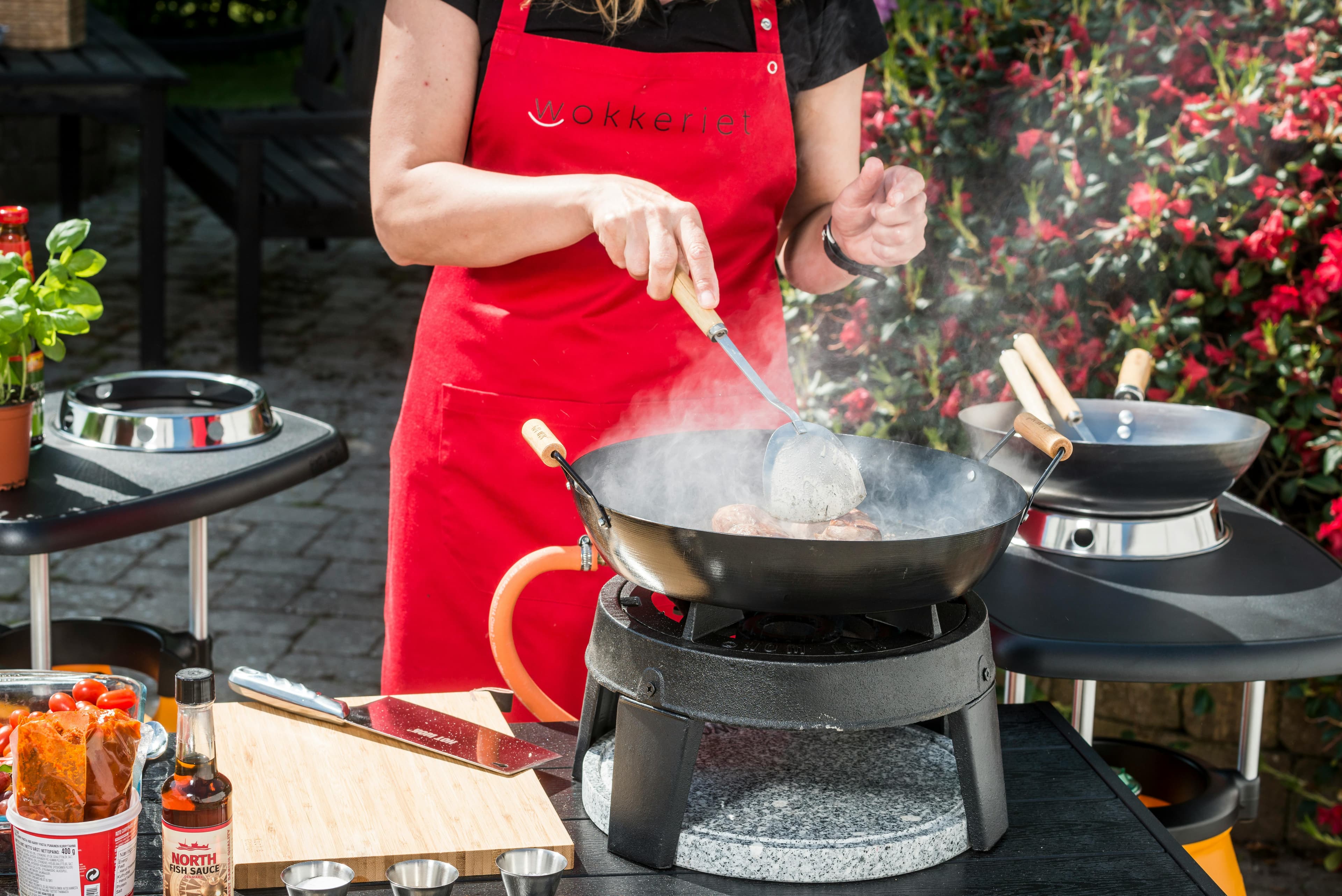 Thai cooking class with wok and steam, learning to cook authentic Thai food