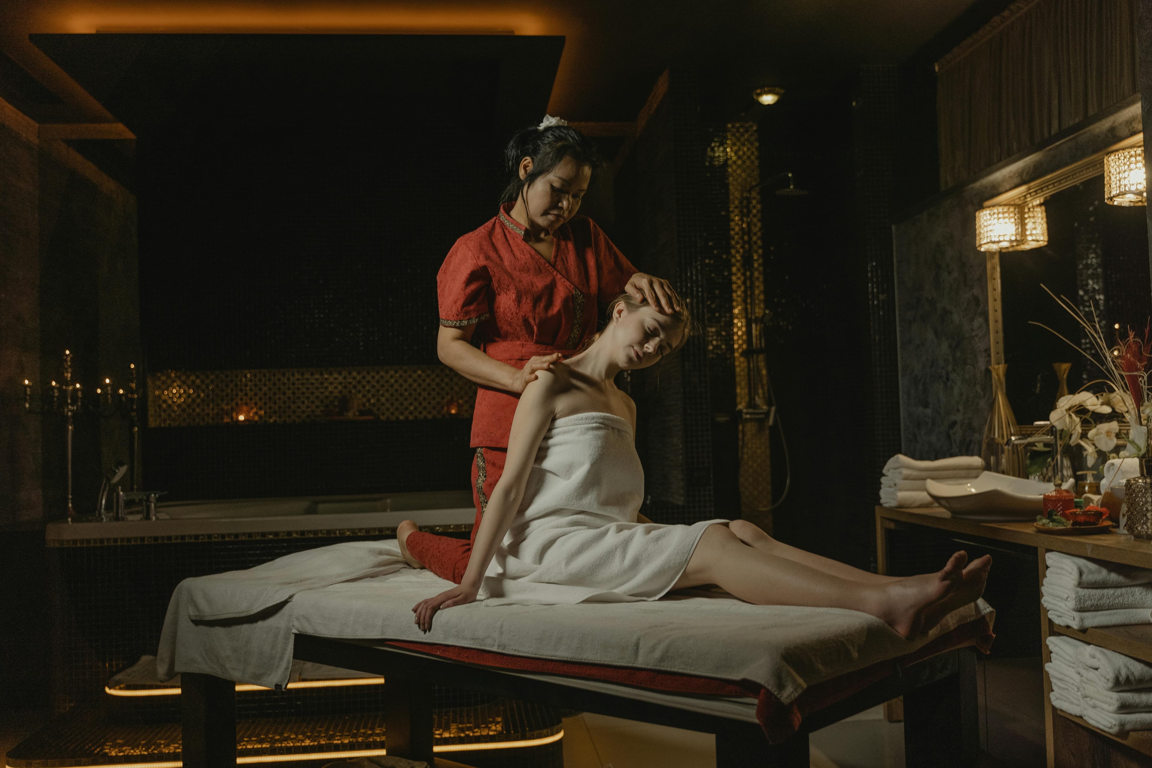 Traditional Thai oil massage session in a luxury spa setting in Chiang Mai