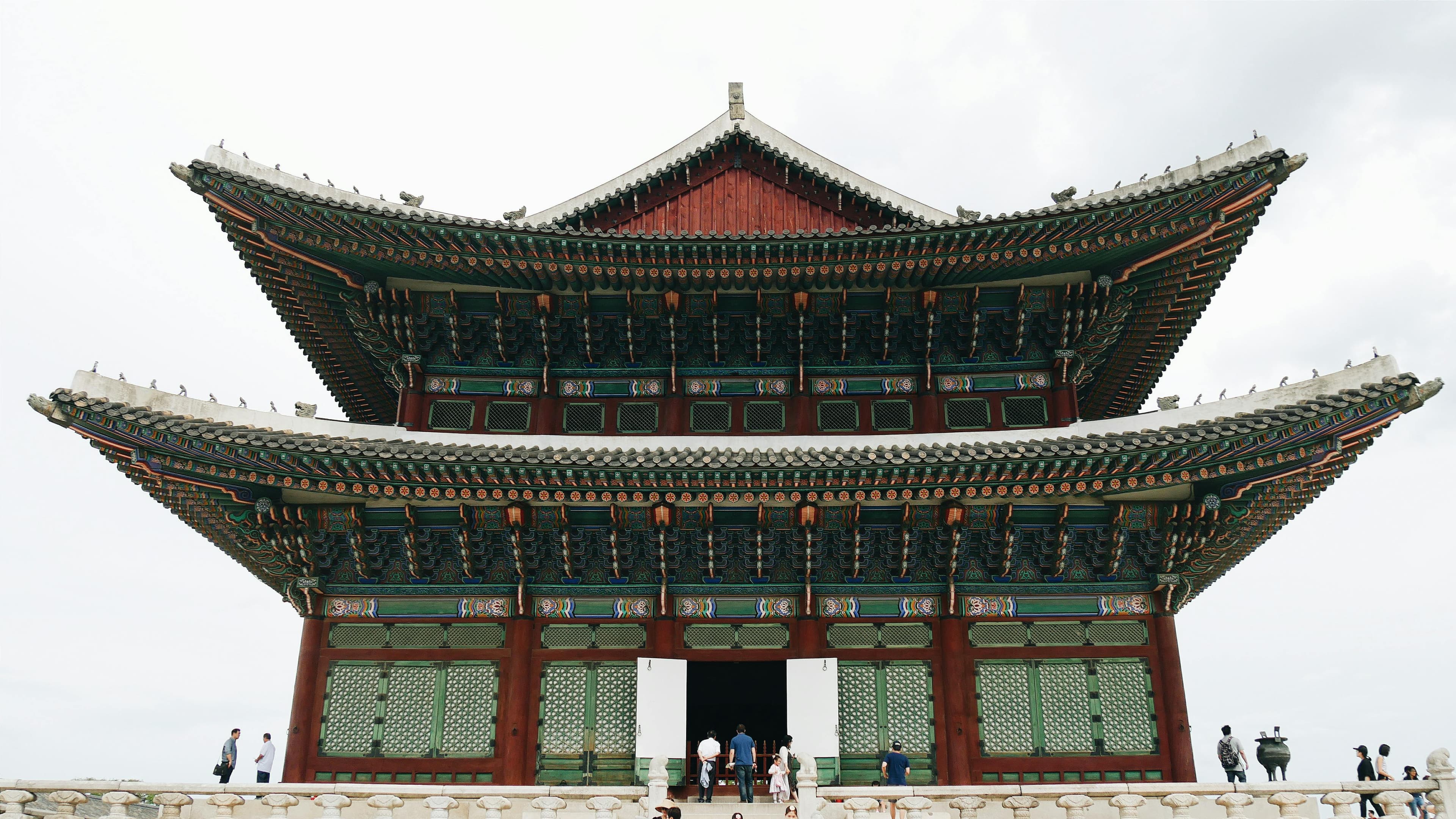 Gyeongbokgung Palace traditional Korean architecture with colorful rooflines and stone guardians Seoul