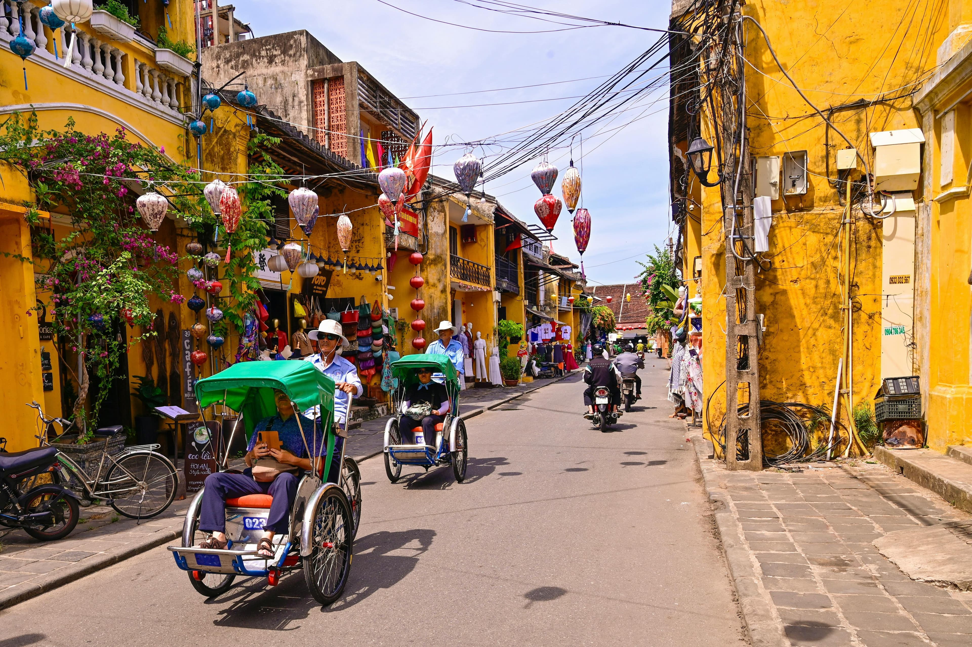 Yellow buildings and colourful lanterns lining the ancient streets of Hoi An Old Town