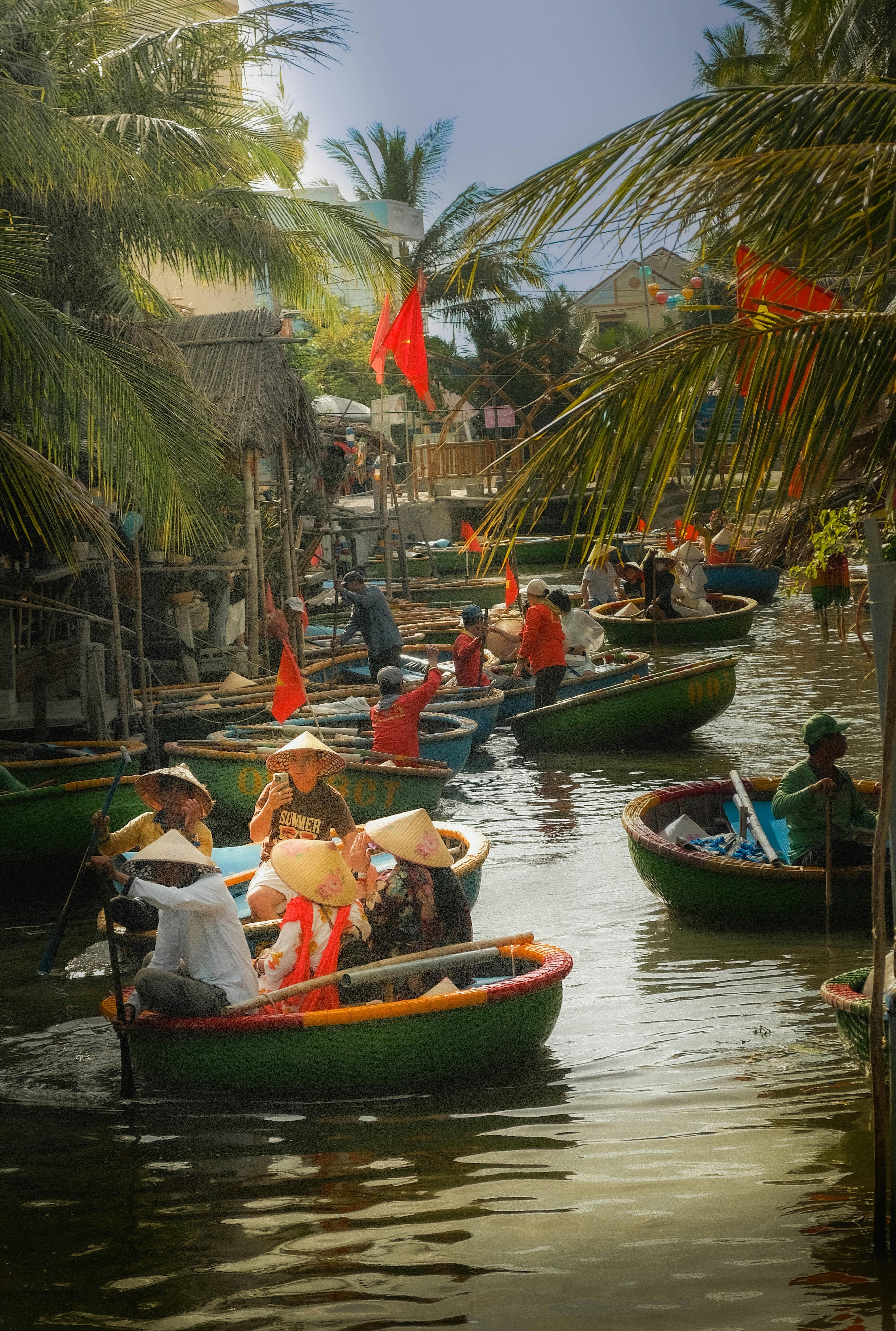 Traditional circular bamboo basket boats in the mangrove coconut forest near Hoi An