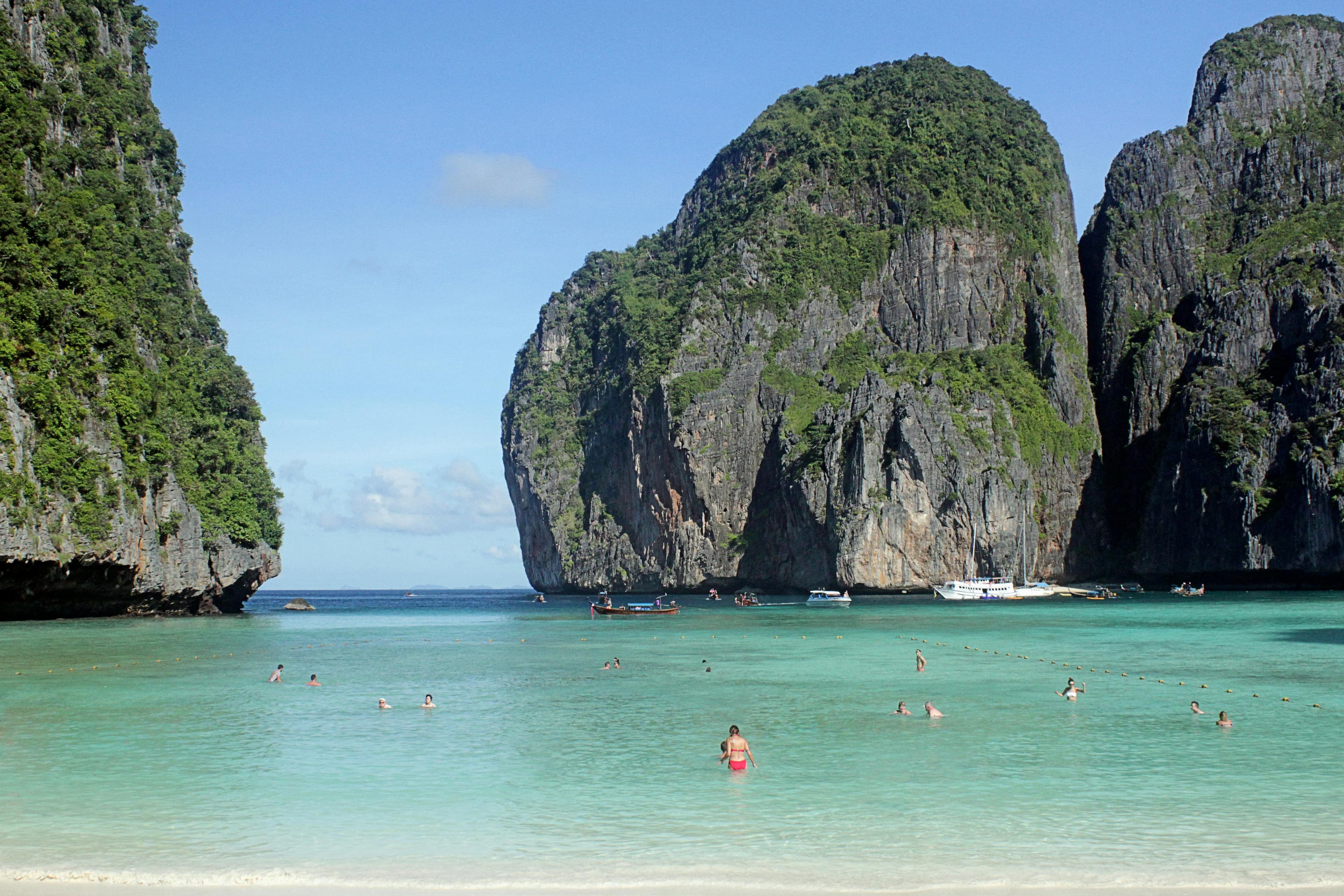 Maya Bay with its famous white sand beach surrounded by limestone cliffs and turquoise water