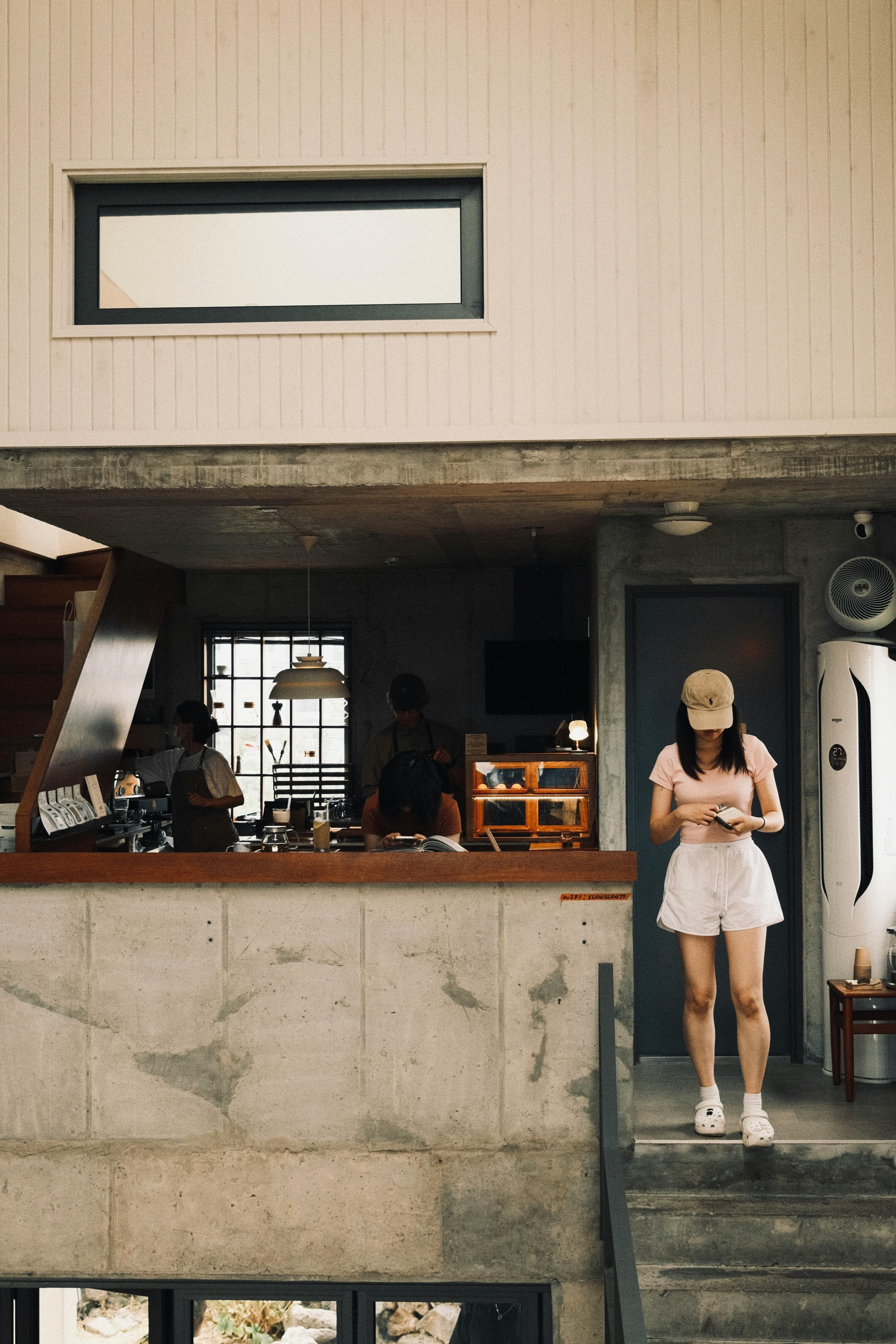 Seongsu-dong industrial cafe Seoul with concrete walls wooden counter and minimalist coffee shop interior Brooklyn of Seoul