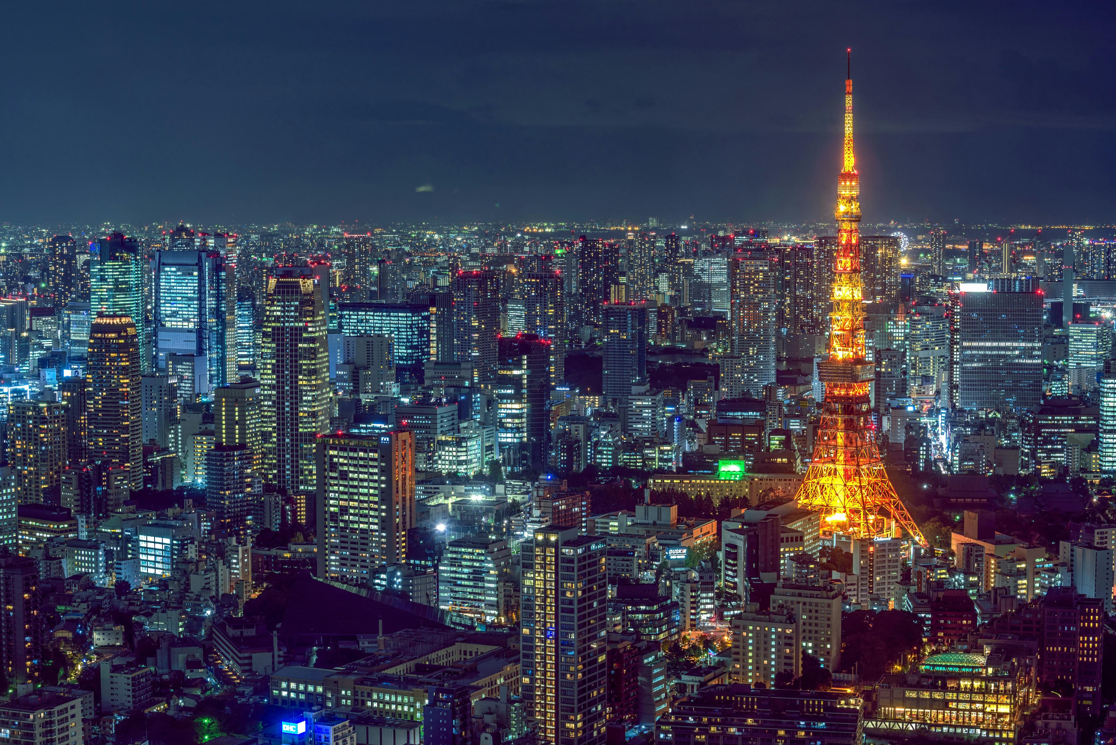 Tokyo skyline at dusk with traditional and modern architecture representing the city diverse neighborhoods