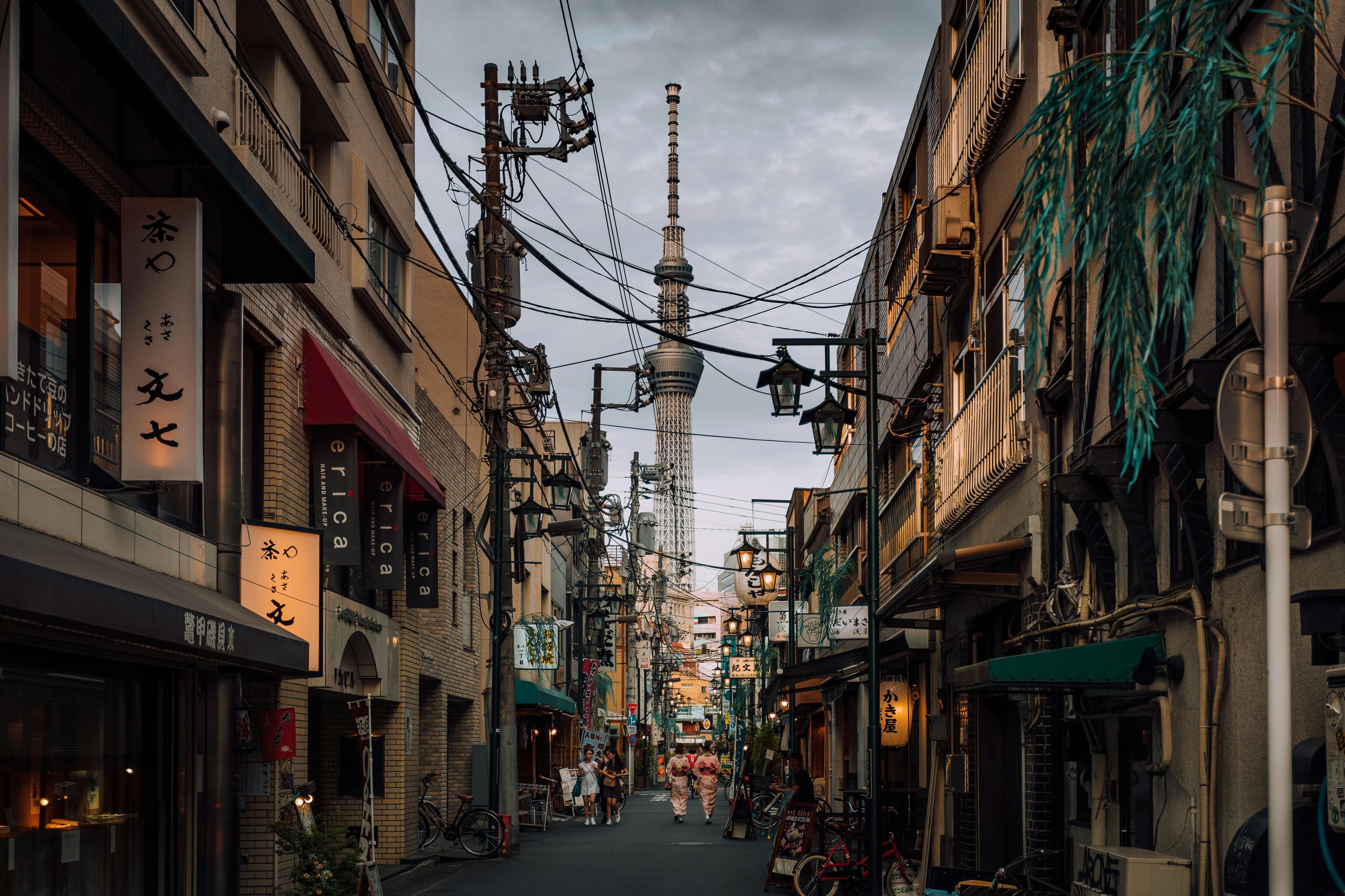 Yanaka Tokyo traditional shitamachi street with Tokyo Skytree in background two women in kimono walking